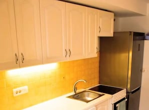 Fridge, microwave, oven, cookware/dishes/utensils