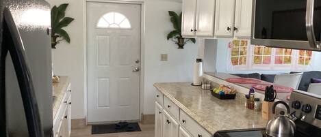 Condo, Non Smoking, Garden View | Private kitchen | Coffee/tea maker, full-sized fridge, microwave, oven