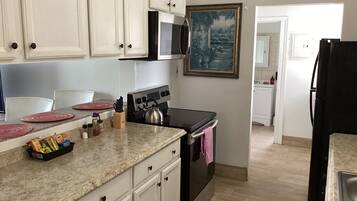 Condo, Non Smoking, Garden View | Desk, laptop workspace, iron/ironing board, WiFi (free)