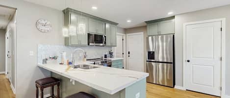 Coffee/tea maker, fridge, microwave, oven