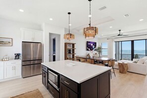 Coffee/tea maker, fridge, microwave, oven - Sunset Oasis: Beachfront Bliss with 2 Pools, Fire Pits & Room for 16 (Melbourne Beach)
