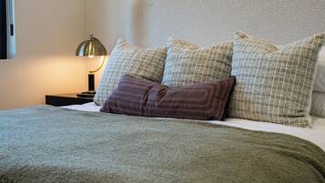 Iron/ironing board, travel crib, free WiFi, bed sheets