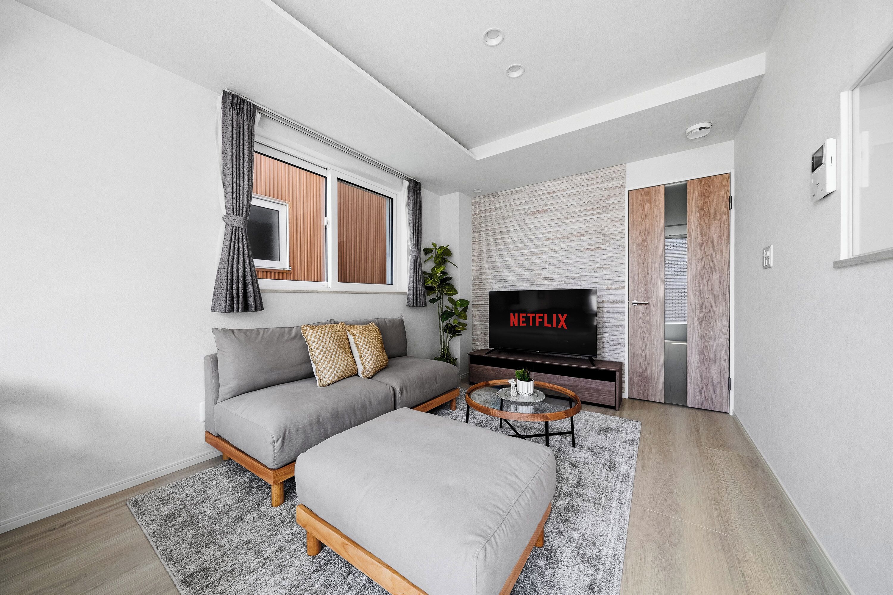 Apartment | Living area | 50-inch flat-screen TV with digital channels