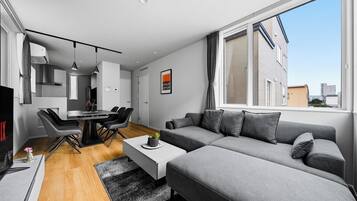 Apartment | Living area | 50-inch flat-screen TV with digital channels