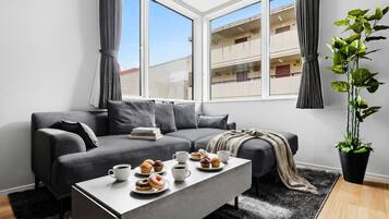 Apartment | Living area | 50-inch flat-screen TV with digital channels