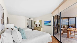 A hotel room with a bed, a desk, a chair, a dining table with chairs, a large window, and a view of the ocean. - Stunning Oceanview Retreat | Onsite Dining and Sauna | M609 (Myrtle Beach)