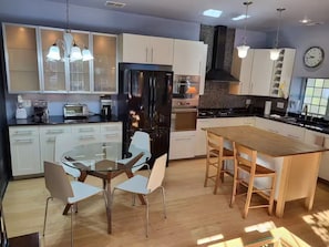 Coffee/tea maker, fridge, microwave, oven
