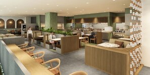 Un intérieur de restaurant moderne avec des tables hautes, des banquettes et un espace bar.