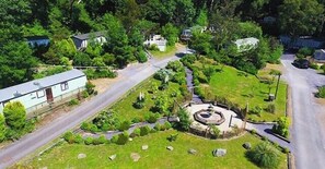 A residential area with houses, a circular driveway, and a small garden.