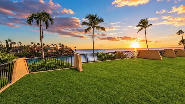 A resort with a pool, palm trees, and a sunset view. - Napili Point | Oceanfront 1 BR | Car Incl. w/ 6+ Nights | NAP-B28 by KBM (Lahaina)
