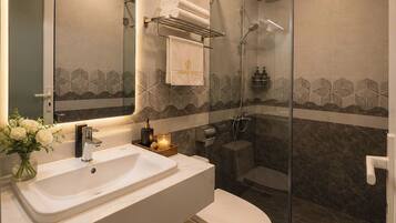 Shower, eco-friendly toiletries, hair dryer, slippers
