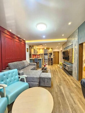 Suite Deluxe, vue jardin | Coin séjour