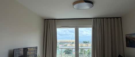 Departamento Deluxe, balcón | Área de sala de estar