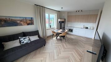 Deluxe Apartment, Balcony | Living area
