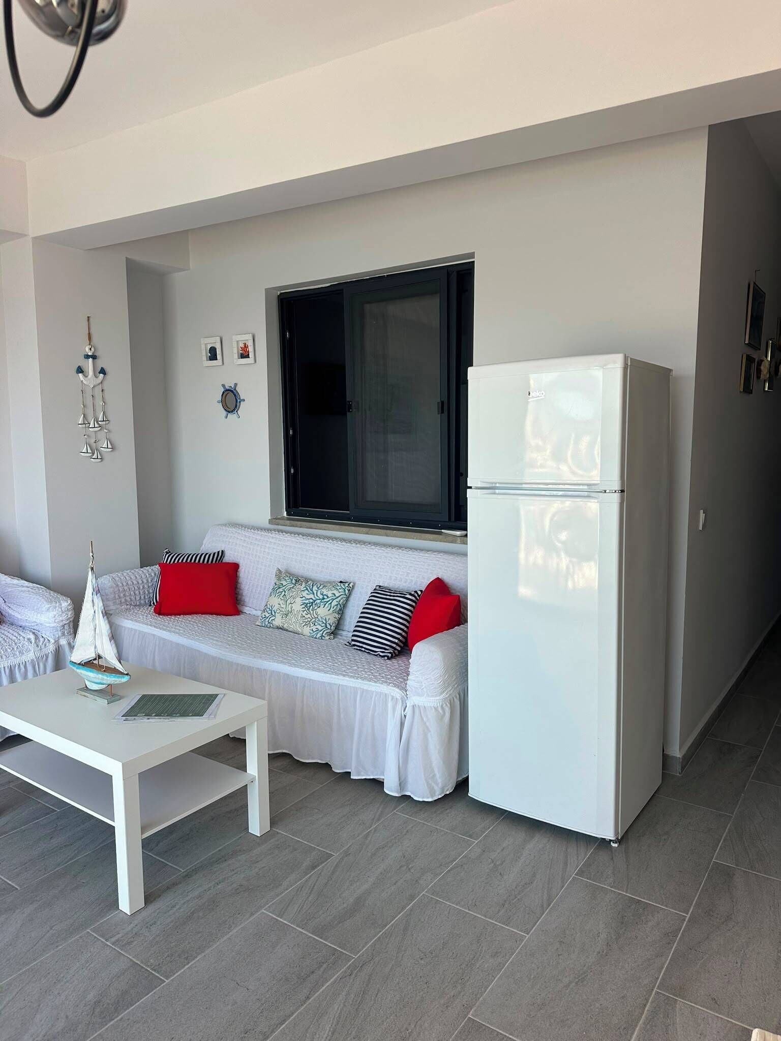 Suite familiare, vista mare | Area soggiorno