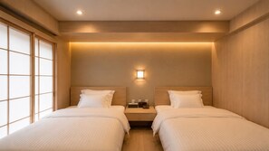 A hotel room with two beds, a nightstand, a wall-mounted light, and a sliding door. - BACOWA AWAZA (Nishi-ku, Osaka)