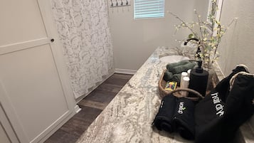 Shower, hair dryer, towels, toilet paper
