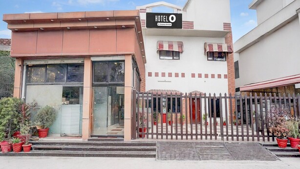 A hotel with a glass facade, a signboard, and a gated entrance. - Saver Double Hotel Shivam Residency (Dehradun)