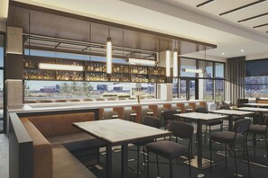 A modern bar area with seating and a city view. - AC Hotel Dallas Uptown (Dallas)