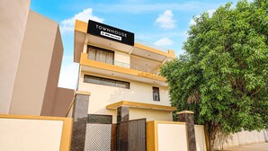 A modern townhouse with a sign indicating it is serviced by OYO. - Townhouse Sector 13 Gurgaon (Gurugram)