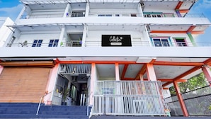 A multi-story building with a prominent sign reading 'Collection.' - Saver Double Ruthran Guest House (Tirukalukundram)