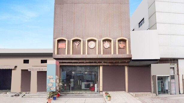 A hotel named 'OYO Hotel R1 Inn' with a modern facade, a reception area, and a visible entrance. - Saver Double Hotel R1 Inn (Jalandhar)