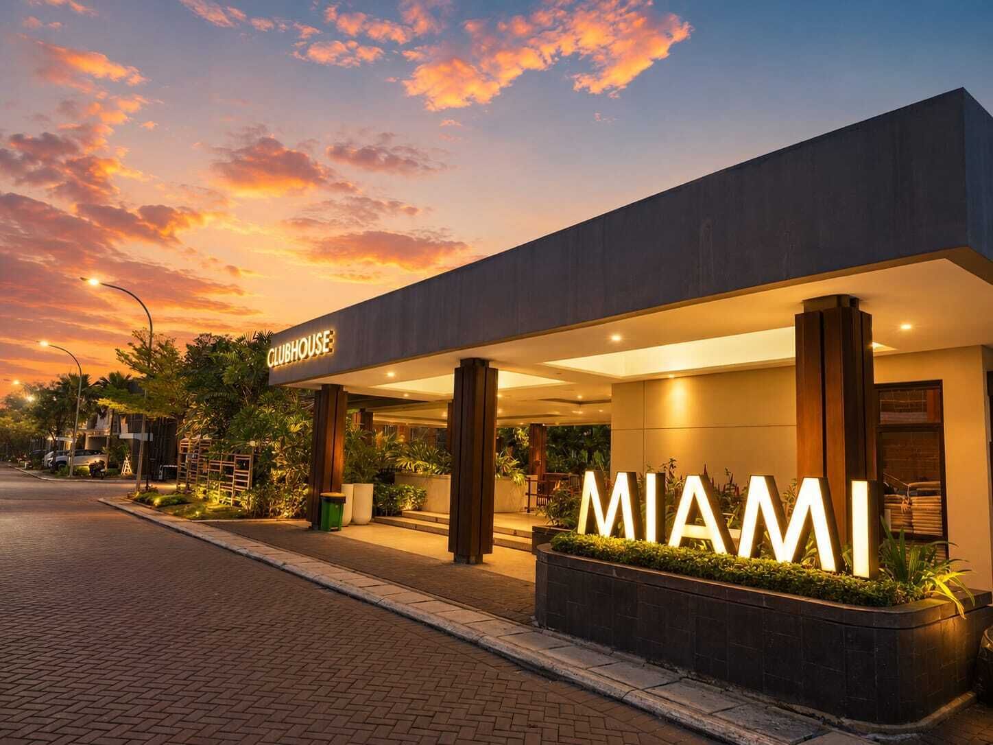 A modern building with a 'CLUBHOUSE' sign and 'MIAMI' illuminated sign.