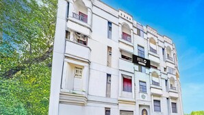 A multi-story hotel with a sign indicating it is a hotel. - Classic Agp Home Stay (Chennai)