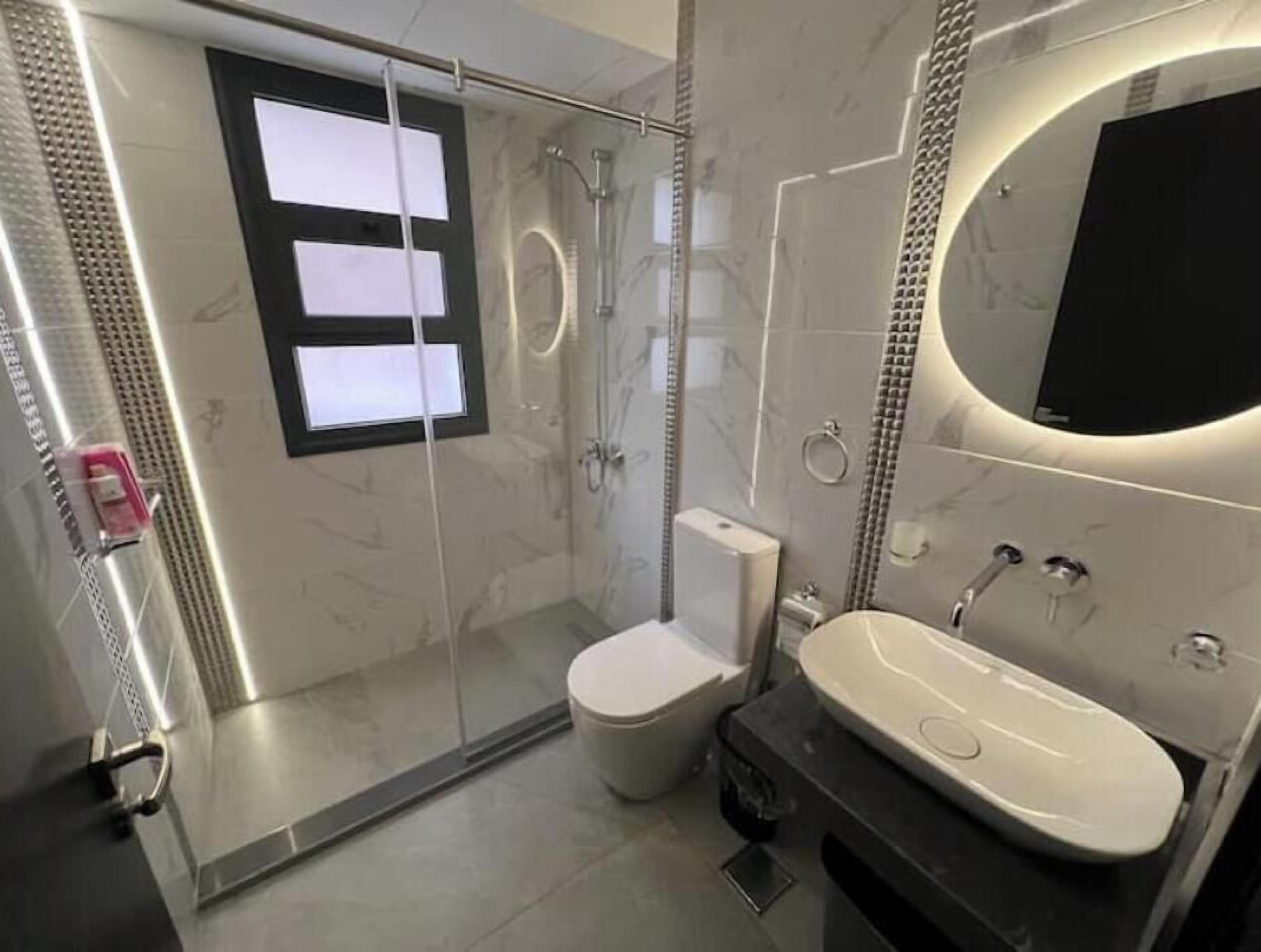 Shower, towels, soap, toilet paper