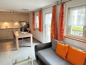 A modern apartment with a kitchen, dining area, and living room. - Alpenstern Appartement/Fewo 4-Bettwohnung "Älpi" by Interhome (Saas-Fee)