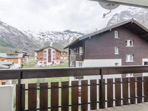 A residential building with a balcony, a mountain view, and a satellite dish. - Alouette Appartement/Fewo 2-Bettwohnung Nr. 17 by Interhome (Saas-Fee)