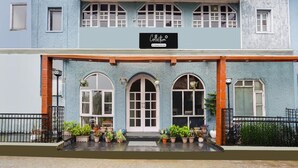 A two-story building with a sign reading 'Collection.' - Super Collection O Mall Road (Dehradun)