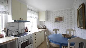 Fridge, microwave, high chair, cookware/dishes/utensils