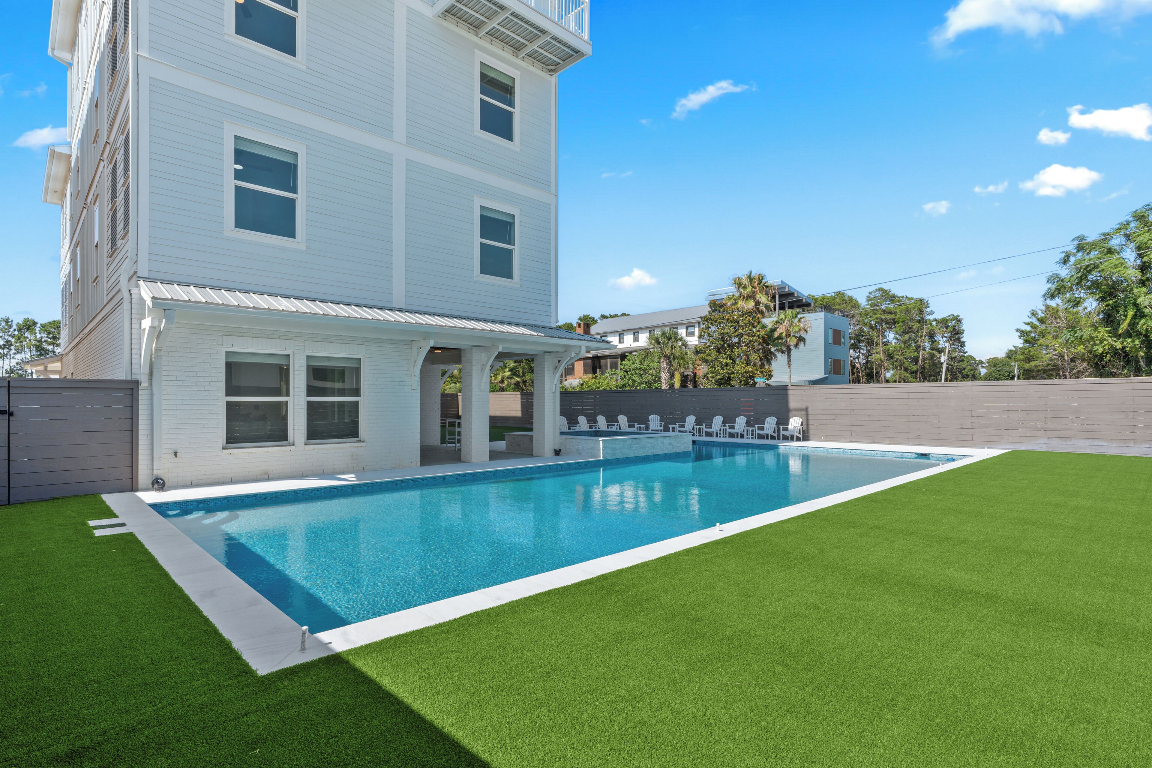 Private pool and raised spa with a covered terrace just steps from the water.