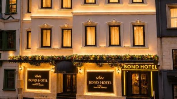 A multi-story hotel with a classic facade, multiple windows, and a sign indicating it is the Bond Hotel. - Bond Hotel Istanbul (Istanbul)