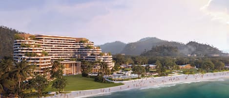 A multi-story hotel with a curved facade, a beachfront, and a pool area.