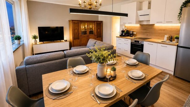 A modern kitchen with a dining area, a TV, and a sofa. - Apartment da Roberto - 3 (Langenhagen)