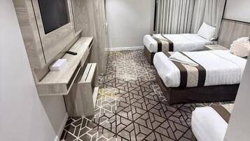 Quarto triplo luxo | Roupas de cama premium, frigobar, individualmente decorados