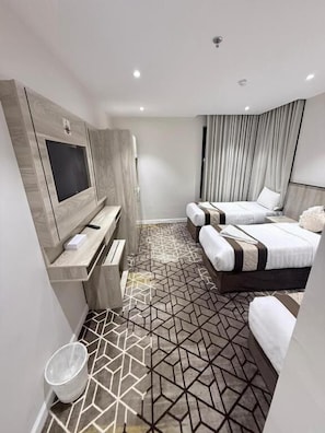 Deluxe Triple Room | Premium bedding, minibar, individually decorated, individually furnished - Ritaj Al-Tala'i Hotel (Makkah)