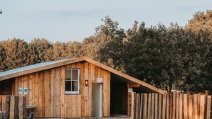 A wooden building with a sloped roof, a door labeled 'Reception,' and a fenced area. - Modern Pet-friendly Retreat in Limburg (Heythuysen)