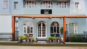 A two-story building with a sign reading 'Collection.' - Classic Villa Barlow (Dehradun)