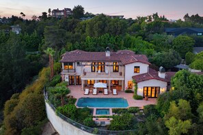 A large, multi-story house with a swimming pool, surrounded by lush greenery and hills. - Bel Air Panorama - Mediterranean Estate w/ Resort-Style Grounds (Bel Air)