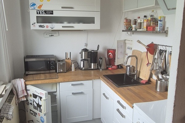 Bright, functional kitchen with wood countertops and modern essentials