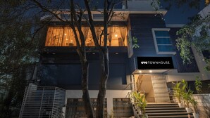 A modern two-story house with a visible staircase and a balcony. - Premiumsri Sai Suites (Bengaluru)