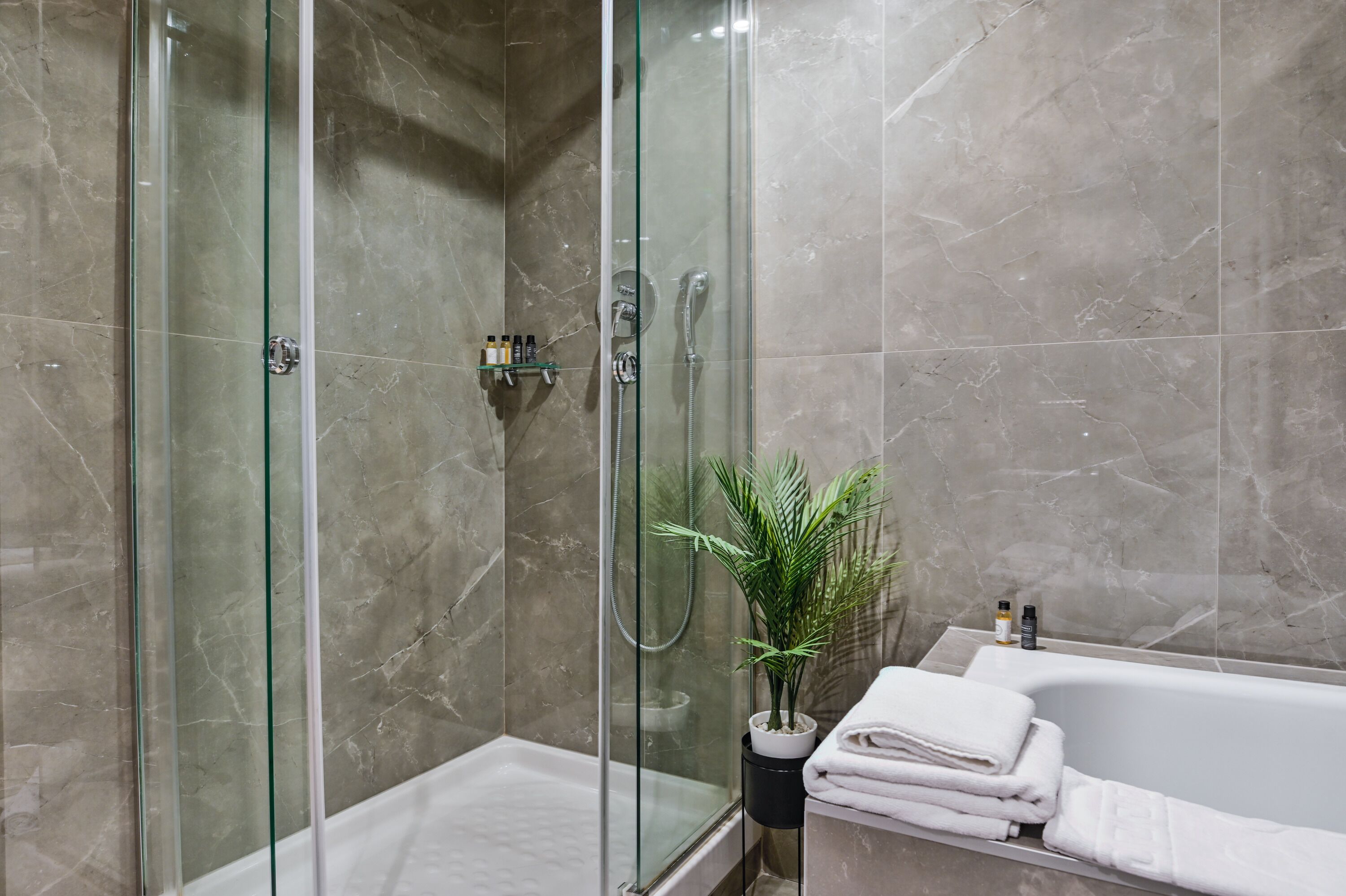 Comfort Suite | Bathroom | Hair dryer, slippers, towels, soap