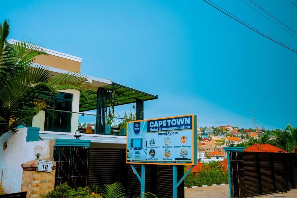 A hotel sign with services like accommodation, restaurant, and massage.