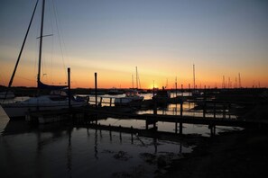 A marina at sunset with boats docked. - No 1 The Martins (Reydon)