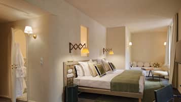 A hotel room with a bed, bedside lamps, a chair, a small table, and a mirror.