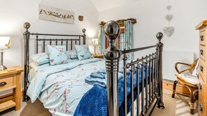 A bedroom with a bed, a nightstand, a dresser, and a chair. - 2 Bed in Pickering (oc-y114) (Pickering)