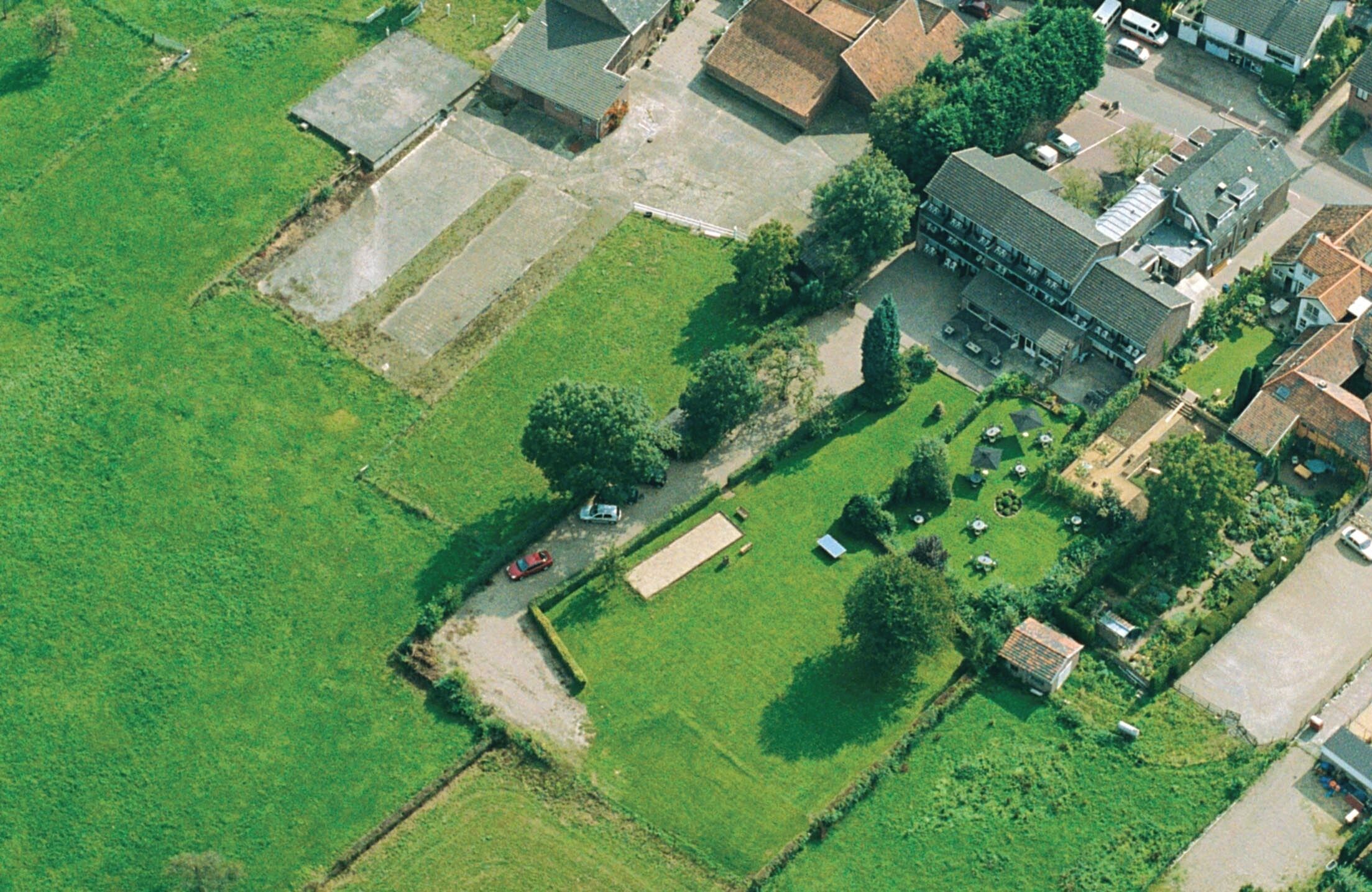 See the property’s spacious grounds from above, beautifully green.